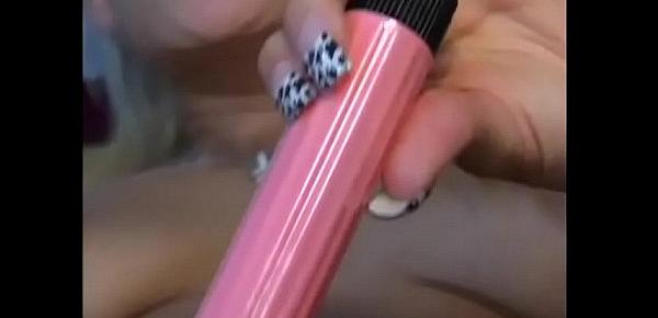  Nasty fair-haired floozie Angel Couture likes to take a draw at a cigarette while she is rubbing her muff with pink dildo